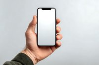 Hand holding modern smartphone with blank white screen against neutral background, perfect for app or website mockup presentation.