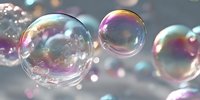 Colorful soap bubbles floating in air with rainbow reflections and iridescent surface creating dreamy atmosphere for backgrounds and design projects.