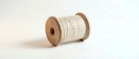 Wooden spool with white cotton thread isolated on white background for crafting and sewing projects.