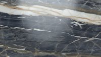 Elegant dark gray marble surface with golden veins and natural stone texture for luxury interior design and architectural applications.