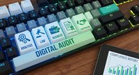 Digital audit concept with keyboard featuring compliance icons and financial report on wooden desk for business technology solutions.