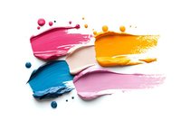 Colorful cosmetic smears of creamy texture with drops and splashes on white background, makeup swatches showing pink, orange, blue and rose shades.
