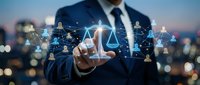 Professional businessman touching digital justice scale with network connections representing legal technology and law firm services.
