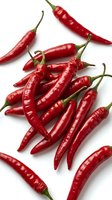 Fresh red chili peppers isolated on white background, arranged overhead view. Vibrant spicy ingredients for cooking, culinary use, food photography, recipes.