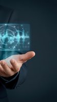 Businessman hand holding holographic display with financial data analytics, stock market charts, and digital waveforms for business intelligence and investment concepts.