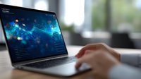 Digital analytics dashboard with glowing blue data visualization on laptop screen, hands typing on keyboard in modern office setting. For business and technology concepts.