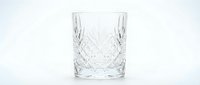 Crystal cut glass tumbler with diamond pattern design isolated on white background for luxury drinkware and elegant dining concepts.