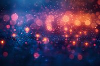 Magical glowing bokeh lights on dark blue background with orange and pink sparkles creating dreamy atmospheric effect for festive designs.