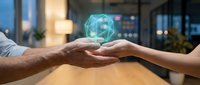 Business partnership concept with hands exchanging glowing digital globe hologram in modern office environment representing global collaboration and teamwork.