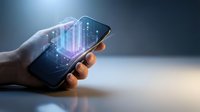 Hand holding smartphone with holographic data visualization and digital analytics display emerging from screen in futuristic technology concept.