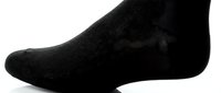 Black ankle sock on a foot shown in side profile against a white background, showcasing comfort and everyday casual wear style.