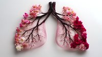 Anatomical lung model decorated with pink and red flowers, representing respiratory health and nature's healing power.