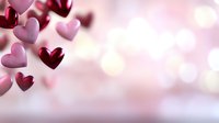 Romantic floating hearts in burgundy and pink colors against soft bokeh background, love concept for Valentine's Day cards and romantic designs.
