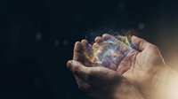 Hands holding glowing digital globe with particle effects, representing global connectivity, technology innovation, and worldwide business communication for web and marketing use.