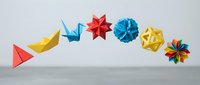 Colorful origami paper crafts arranged in a row including folded boats, stars, and geometric shapes in red, yellow, and blue tones for creative projects.