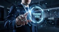 Professional businessman in suit touching futuristic holographic thank you interface with glowing blue digital circles and network connections.