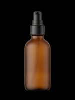 Amber glass spray bottle with black pump dispenser isolated on transparent background, ready for cosmetics, skincare, perfume, and essential oil packaging design projects.