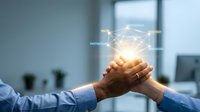 Two businesspeople join hands over glowing network connection diagram with linked nodes and labels in modern office environment, representing teamwork, partnership, collaboration, and digital transformation.