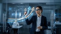 Businessman in glasses pointing at glowing upward arrows and financial charts in modern office, representing growth, success, and data analysis for business presentations.
