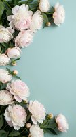 Soft pink peonies arranged on mint green background with copy space for wedding invitations, greeting cards, and feminine branding projects.