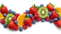 Fresh mixed berries and fruits including strawberries, blueberries, raspberries, kiwi and orange slices arranged on white background for healthy eating.