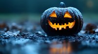 Spooky black jack-o-lantern pumpkin with glowing orange face sits on dark ground creating eerie Halloween atmosphere for seasonal decorations and horror themes.