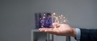 Professional businessman hand presenting glowing digital justice scales with network connections and light effects for legal technology concepts.