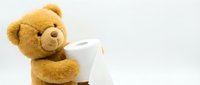 Adorable brown teddy bear holding white coffee mug on clean background, perfect for cozy morning concepts, comfort themes, and childhood memories.