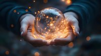 Glowing crystal ball with magical sparkles held in hands against dark background, mystical fortune telling sphere radiating warm light and energy.