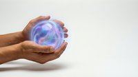 Hand holding glowing orb with blue and purple energy swirls, isolated on white background for technology, innovation, and future concepts.