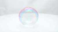 Single soap bubble with rainbow iridescent colors floating against clean white background for design projects and commercial use.