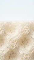 Creamy foam bubbles texture with white background for beverage and skincare product design applications.