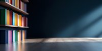 Colorful book spines on wooden shelf with dramatic lighting and dark background create atmospheric mood. Diagonal light beam adds depth and mystery to library scene.