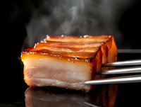 Steaming hot sliced pork belly with crispy caramelized top and tender meat layers, held with metal tongs against dark background, dramatic food photography.