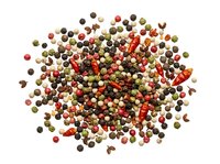 Mixed peppercorns and dried chili peppers isolated on white background, ready for culinary design, food packaging, and cooking content use.