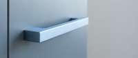 Modern white floating shelf mounted on gray wall for minimalist home decor and storage solutions in contemporary interior design.