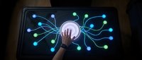 Hand touching glowing digital network interface on tablet screen with connected nodes and data visualization for technology and connectivity concepts.