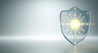 A transparent shield with a glowing geometric network pattern inside, symbolizing digital security, data protection, and cybersecurity solutions for technology and business applications.