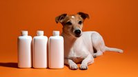 Small white and brown terrier dog lying next to three white plastic bottles on vibrant orange background, studio product photography setup for cosmetics or pet care items.