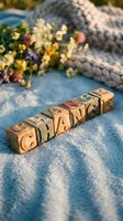 Vintage wooden letter blocks spelling CHANGE on a soft blue blanket with wildflowers, symbolizing growth, transformation, and new beginnings.