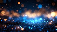 Magical glowing blue and gold bokeh lights on dark background with sparkle effect and defocused particles creating dreamy atmosphere.