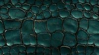 Dark emerald green crocodile leather texture with detailed scales and natural pattern. Luxury fashion material surface close up for design backgrounds.