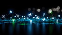 Digital technology network with glowing business icons floating above circuit board background representing connectivity and innovation solutions.
