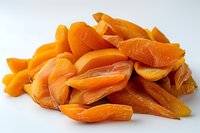 Fresh dried apricots in bright orange color on white background, perfect for healthy eating lifestyle blogs and natural food packaging design projects.