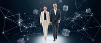 Professional business team standing in futuristic digital network environment with connected data cubes and glowing technological elements.