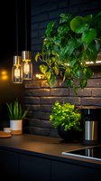 Modern dark kitchen interior with hanging pothos plant, vintage Edison bulb pendant lights, and black brick wall creating cozy atmospheric lighting.