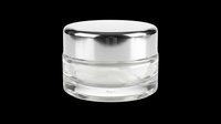 Cosmetic jar with silver metallic lid and clear glass container, isolated on transparent background, ready for beauty product packaging design, t-shirt graphics, and print-on-demand applications.