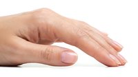 Woman's hand with natural manicure on white background, isolated for healthcare, beauty, skincare, and wellness design projects.