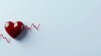 Red glossy heart with heartbeat line on light gray background, medical and healthcare concept for cardiology, heart disease awareness and cardiovascular health.