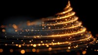 Golden light trails forming elegant spiral waves with sparkling bokeh effects on dark background for luxury design projects and festive decorations.